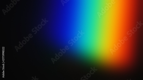 Prism reflection projects a vivid spectrum of blue, green, yellow, and red hues.