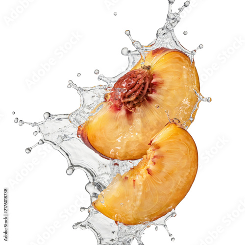 Fresh sliced peach halves with water splashes and droplets on white isolated on a transparent background