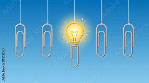 Glowing light bulb replacing a paper clip representing a unique idea and business innovation.