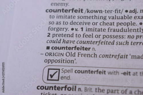 Canvas Print English Dictionary Book Page Close Up With The Word Definition Of - counterfeite