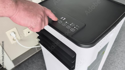 Setting timer on floor standing room air conditioner for three hours in home office location