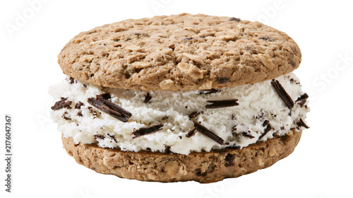 Fotografie Oatmeal chocolate chip cookie ice cream sandwich with shaved chocolate, isolated