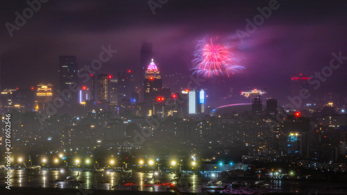 Cuadro en lienzo Fireworks over Taipei skyline beyond an airport on a rainy night