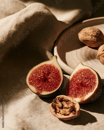 Fresh fig and walnut still life in warm sunlight