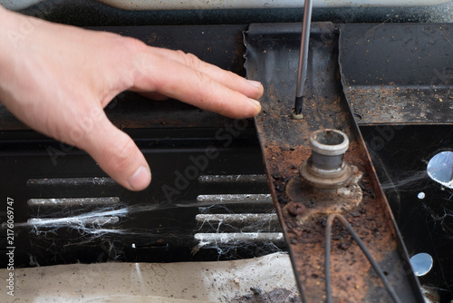 Fotografía Soviet Stove Repair with Screwdriver — Close-Up of a Rusty Interior