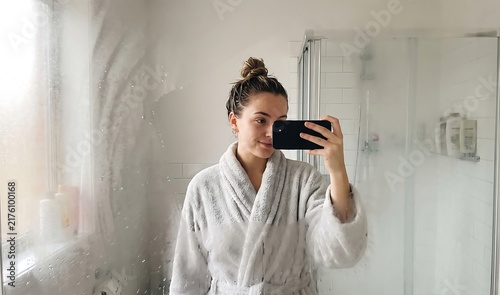 Woman Taking a Mirror Selfie in Bathroom