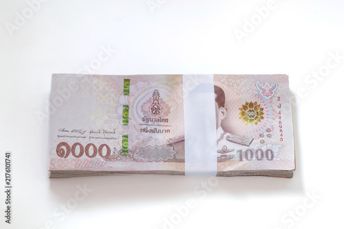 Thai 1,000 baht banknotes, representing money, personal finance, savings, income, expenses, wealth, business, and financial planning.