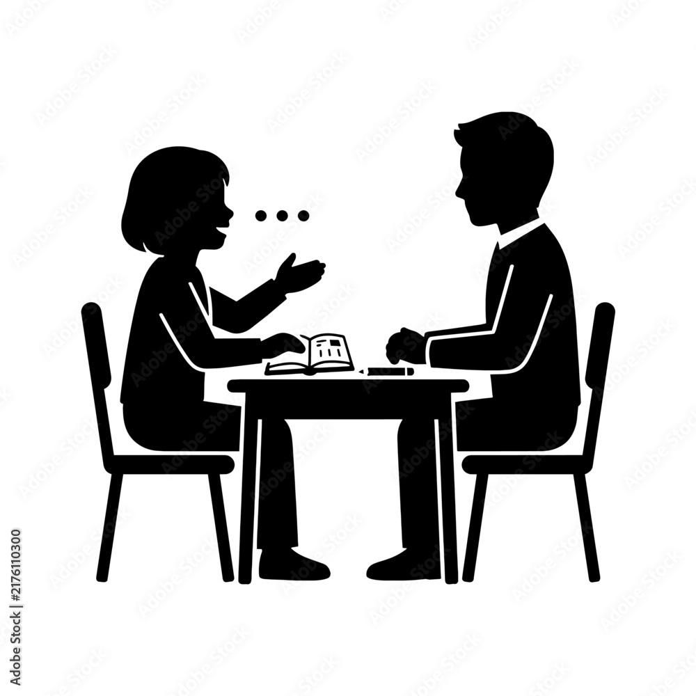 Fototapeta premium Silhouette of student and teacher talking at a desk
