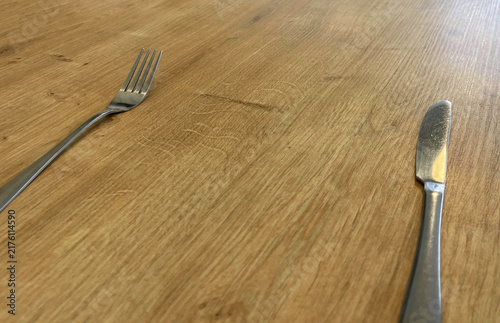 a fork and knife on a table in a restaurant