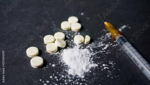 Foto drugs and syringe. Misused drugs concept.