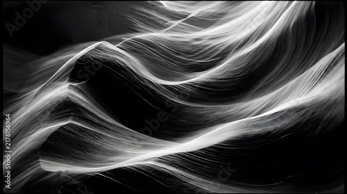 Abstract black and white image featuring flowing, luminous wave-like patterns against a dark background, creating a sense of movement and ethereal beauty.