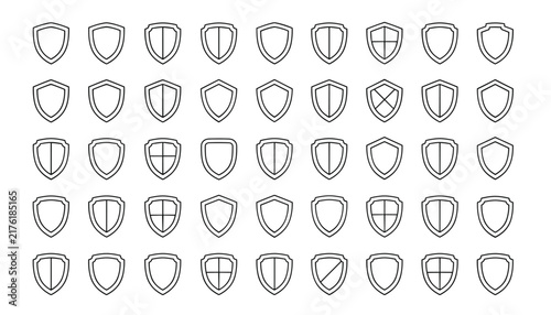 Large collection of outline shield icons representing defense, cybersecurity, protection, and heraldry in a neat grid.