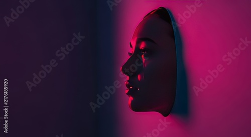 A dark-toned profile rests motionless against a dim wall, eyes lost in thought, conveying a deep sense of internal grief and heartache, melancholy, pensive, burden