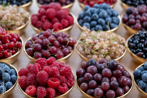 Grid Of Fresh Berry Bowls Viewed From A Close Side Angle