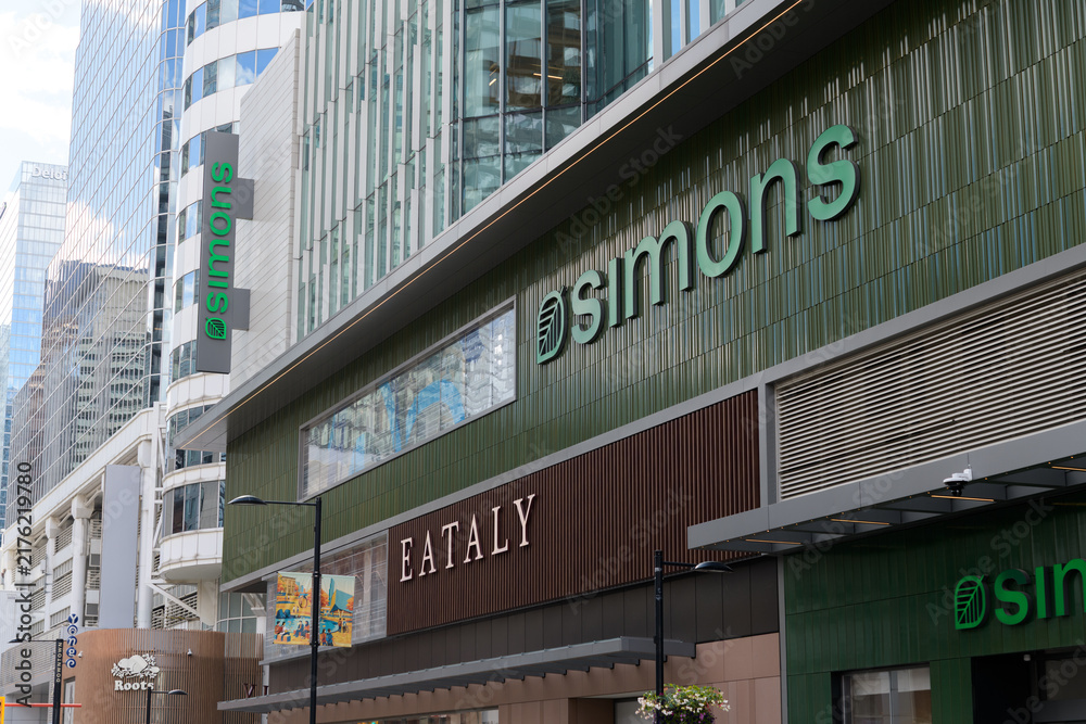 Obraz premium exterior building facade and signage of Eataly, a marketplace and restaurant and Simons, a fashion, apparel, and home goods retailer, CF Toronto Eaton Centre (perspectival, looking south on Yonge St)