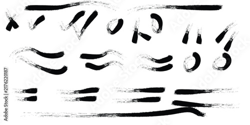 Hand drawn brush strokes and symbols in black on white background conveying correction and emphasis for design elements
