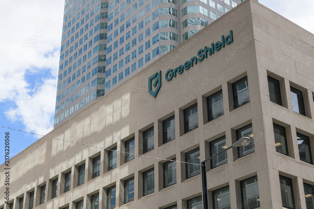 Obraz premium an upward view of Commerce Court South (30 Wellington St W) with sign of GreenShield, a health benefits company, Toronto