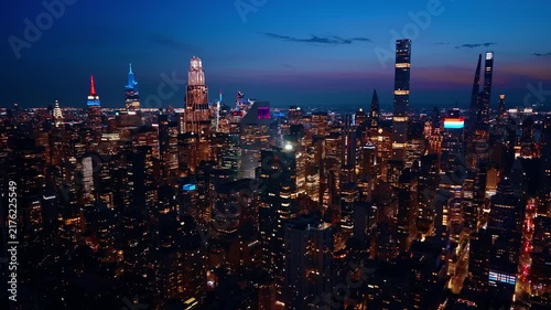 Footage at the tops of skyscrapers in Manhattan. Lights of gorgeous New York City, USA at night.