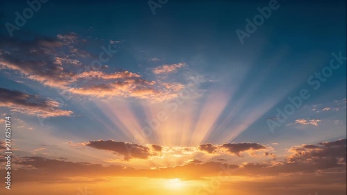 Morning sunbeams piercing bright cloud clusters ideal for earth climate change documentaries