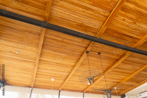 Obraz na plátne Warm wooden beams stretch across the ceiling