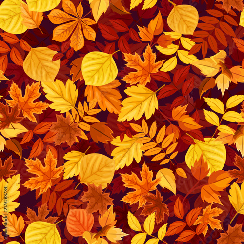 Seamless pattern with orange, yellow, and brown autumn leaves. Vector fall print with colorful fallen leaves