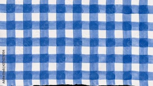 Close-up of a blue and white checkered fabric. the fabric appears to be made up of small squares of different sizes and colors, creating a grid-like pattern.