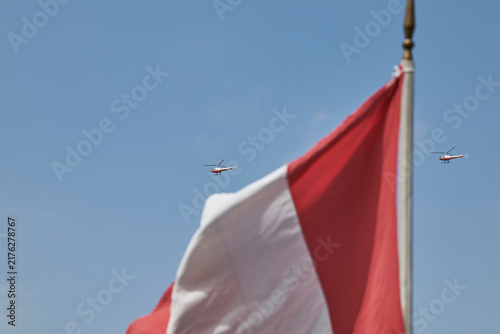 Fotografie Peruvian flag with military helicopters flying in formation