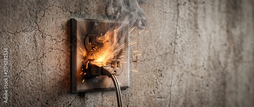 Electrical short circuit with sparks and smoke from a wall power outlet