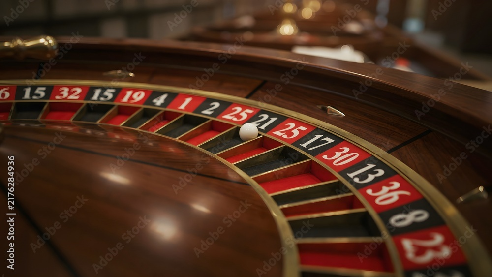 Obraz premium Elegant Casino Roulette Table with White Ball and Wooden Finish