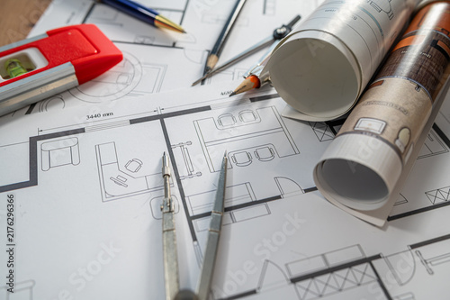Architectural Blueprint Rolls and House Floor Plan Papers for Home Project Design Concept