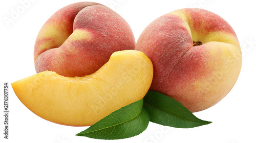 Bild auf Leinwand Two whole ripe peaches and one fresh sliced peach wedge with green leaves