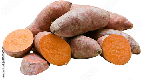 Bild auf Leinwand Whole and sliced raw sweet potatoes with orange flesh and brown skin