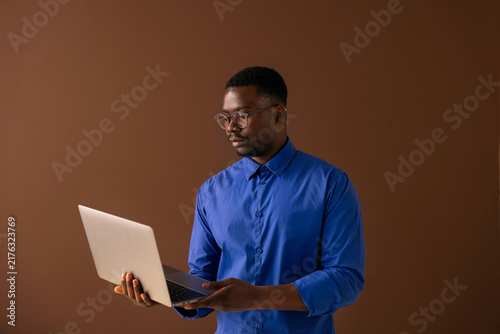 Professional Man Working on Laptop in Studio