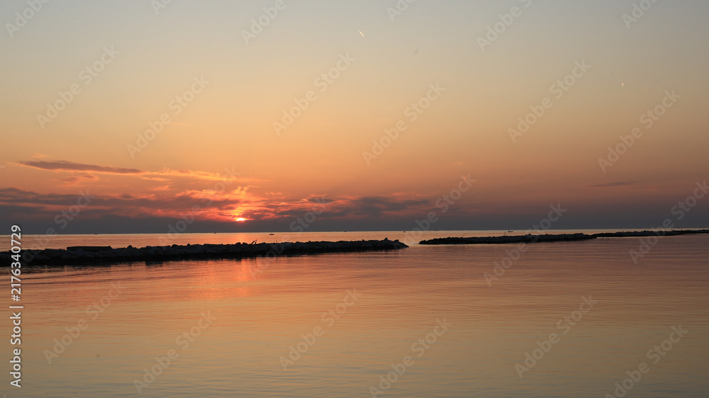 Fototapeta premium Golden Sunrise Reflection on Calm Adriatic Sea in Bari Italy
