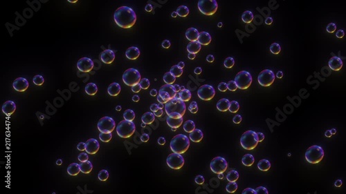 Animation of iridescent transparent soap bubbles floating and dispersing forward as an overlay on a deep black background