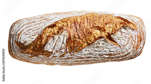 Картината върху платно Crusty golden brown sourdough loaf with flour dusting