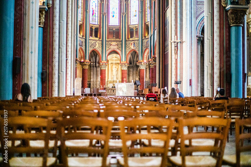 Fotografie Historical Gothic church interior with an altar and parishioners