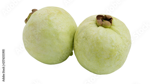 Two fresh whole green guavas with textured skin and brown calyx