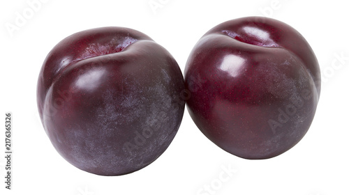 Two ripe dark purple plums with smooth skin and natural waxy bloom