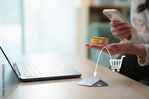 Foto Online shopping return concept with customer holding return parcel while using s