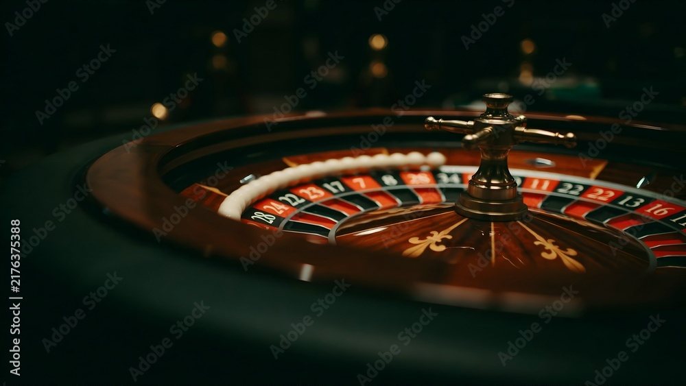 Obraz premium Close-up of a roulette wheel with a spinning spindle in a casino setting