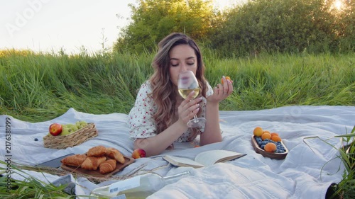 Enjoy a relaxing outdoor picnic with wine and assorted snacks