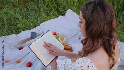 Enjoy a Serene Reading Moment in Nature Surrounded by Fresh Fruits and Beauty