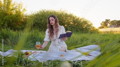 Relax outdoors with a book and wine in a sunlit, beautiful field