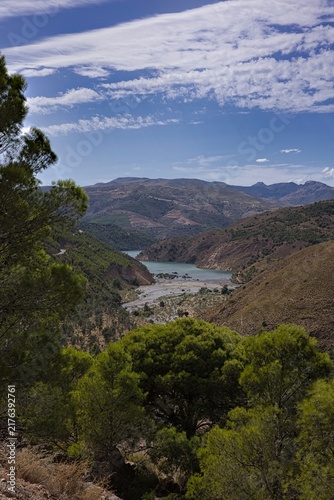 Sierra nevada mountain valley with lake and pine trees