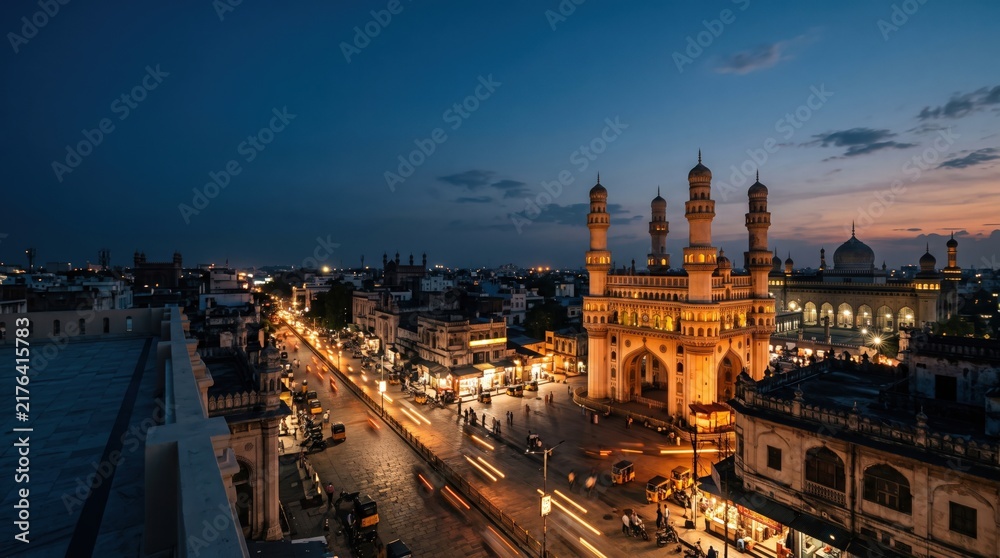 Fototapeta premium Scenic Evening View of Historical Monument and Bustling Street in Hyderabad