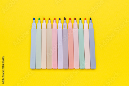 Konstfotografi Colorful Pastel Highlighters on Bright Yellow Background: Vibrant Stationery Art