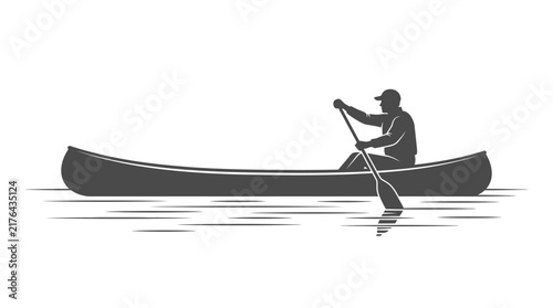 Silhouette of man canoeing on water, paddling a long boat, adventure and leisure