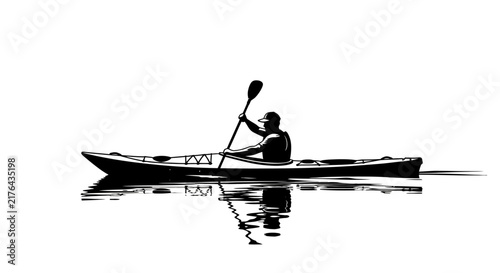 Silhouette of man kayaking on calm water with reflection