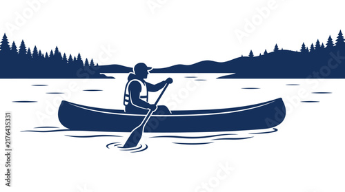 Silhouette of person canoeing on a lake with pine trees and mountains background